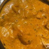 Butter Chicken · Shredded chicken cooked in a tomato butter sauce.