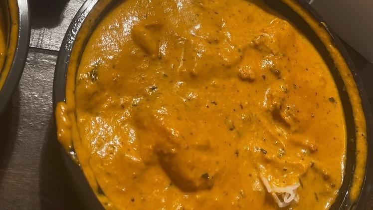 Butter Chicken · Shredded chicken cooked in a tomato butter sauce.