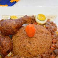 Chep Garnar · Red jollof rice with chicken and onion sauce cooked with shrimp and mixed vegetables on the ...