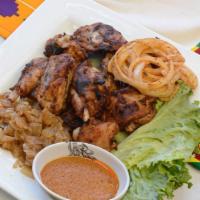 Grilled Chicken  · Grilled cut up leg quarters, served with saute onions and spicy raw onions.