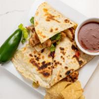 Quesadilla · Golden brown grilled tortillas with queso medley, choice of filling, lettuce, tomatoes and s...