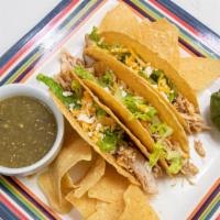 Tacos · Served with your choice of filling, lettuce, tomatoes, sour cream and guacamole.  Served wit...