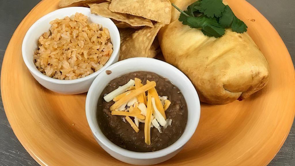Chimichanga · Hand rolled chimi. Served with your choice of filling, fried golden brown, topped with our zesty tomatoes, queso sauce, sour cream and guacamole. Served with rice, tortilla chips, salsa fresca and your choice of beans.