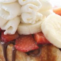 Fresh Fruit Deluxe Waffle · Topped with nutella, two seasonal fresh fruits & homemade whipped cream!