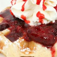 Slowberry Cobbler Waffle · Four berry blend slow cooked in brown sugar topped with homemade whipped cream!
