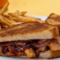 Bbq Chicken Melt · Grilled chicken, crispy bacon, grilled onions, American cheese, and Swiss cheese, topped wit...