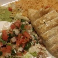 Enchilada, Rice & Beans · A soft corn tortilla stuffed with your choice of filling topped with cheese and enchilada sa...