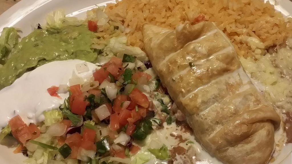 Enchilada, Rice & Beans · A soft corn tortilla stuffed with your choice of filling topped with cheese and enchilada sauce.