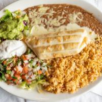 Chimichanga · A flour tortilla stuffed with your choice of beef chunks or spicy chicken, then deep fried t...