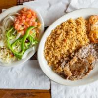 Los Compadres · Mexican spiced ribeye steak topped with juicy shrimp. Served with rice and salad.