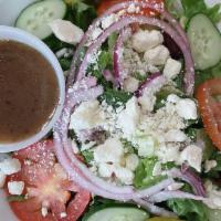 Greek Salad · Romaine Lettuce , Tomatoes, Onions, Cucumbers, Black Olives, Feta Cheese & House dressing.