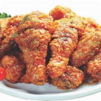 Lunch Wing Spicy · 5 PCS wings with Spicy Garlic Sauce two choices of sides for French Fries or Rice and Coleslaw