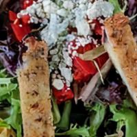 Angelina Insalata · Fresh spring mix with a delicious combination of breaded eggplant, tomatoes, sliced red pepp...