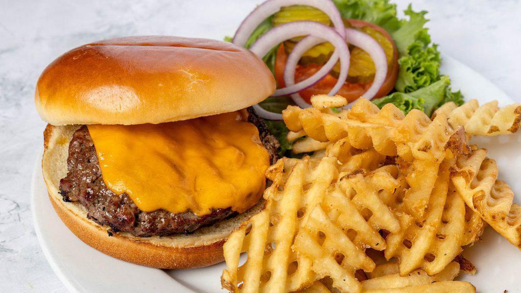 Classic Burger* · Beef patty on a potato roll with lettuce, tomato, onion, and a choice of swiss, white American or cheddar cheese with a side of fries.