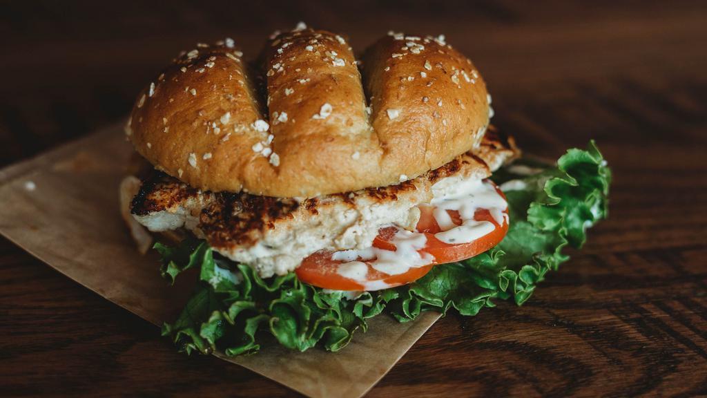 Grilled Chicken Sandwich · 100% all natural chicken breast, grilled with lettuce, tomato and garlic dill aioli.