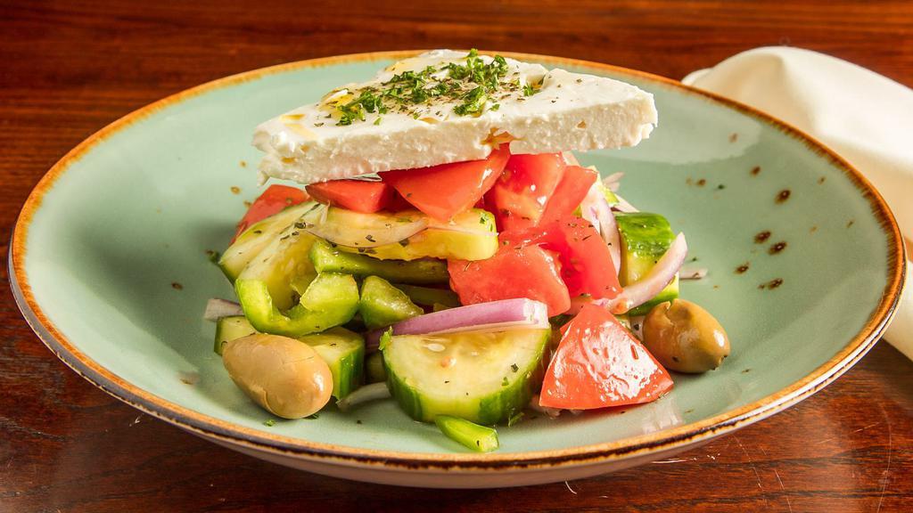 Country Greek · Cucumber, vine-ripe tomato, feta, red onion, green bell pepper, oregano, marinated olives, red wine vinaigrette