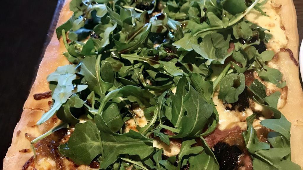 Fig Pizza · Herbed goat cheese, caramelized onions, wild arugula aged balsamic