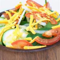 Garden Salad (Small)  · Greens, tomato, cucumber, and cheddar cheese. Served with your choice of dressing.