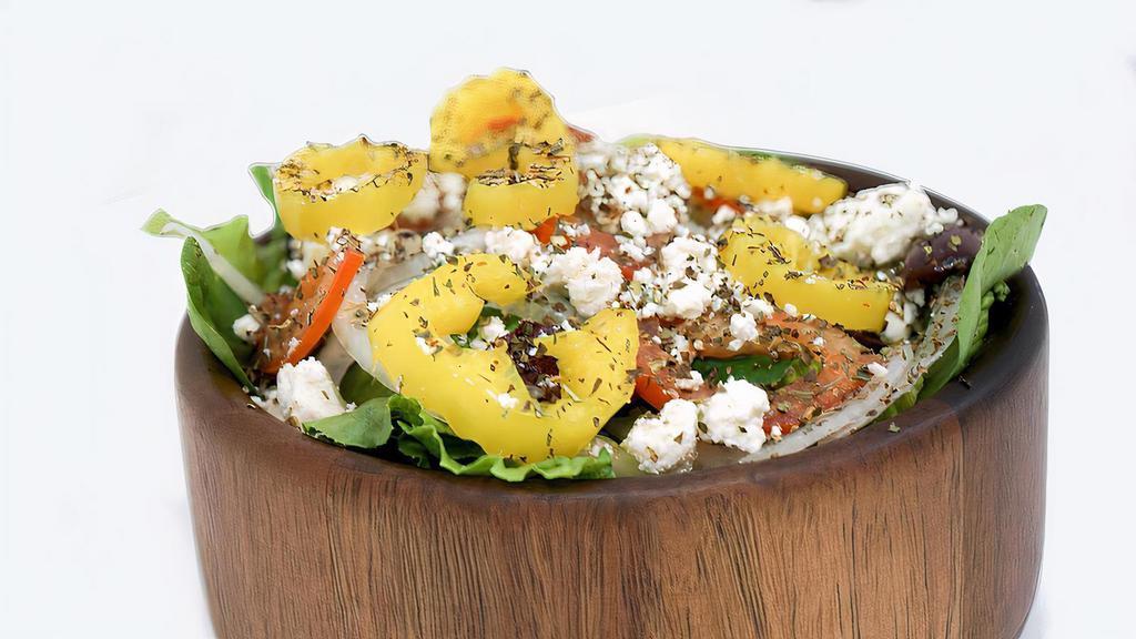 Greek Salad (Large)  · Greens, onions, tomatoes, cucumbers, black olives, green olives, banana peppers, and feta cheese. Served with your choice of dressing.