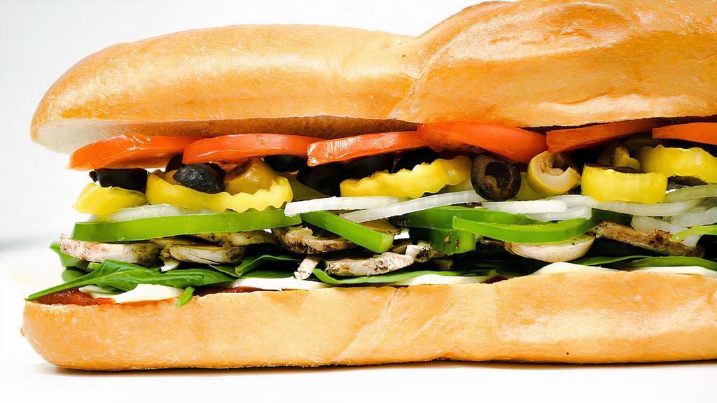 Grilled Veggie Sub (Regular) · Onions, green peppers, mushrooms, black olives, green olives, tomatoes, banana peppers, and cheese.