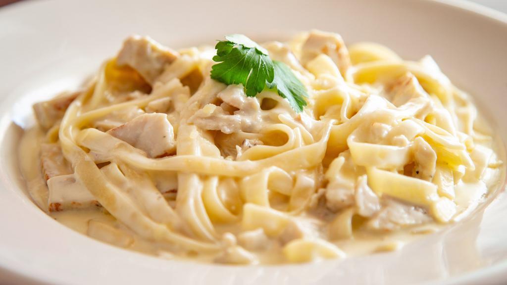 Fettuccine Alfredo · Fresh fettuccine noodles covered with creamy Alfredo sauce. Add chicken for an additional charge.