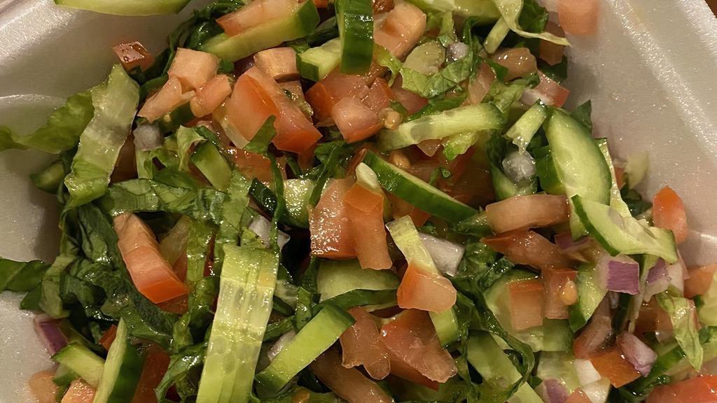 Arabic Salad · Fresh chopped tomatoes, lemons, cucumbers, green onion, lettuce and parsley.