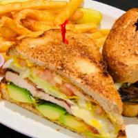 Grilled Chicken & Avocado Club · Grilled chicken breast with avocado, bacon, tomato, melted swiss, and mayonnaise. Served on ...