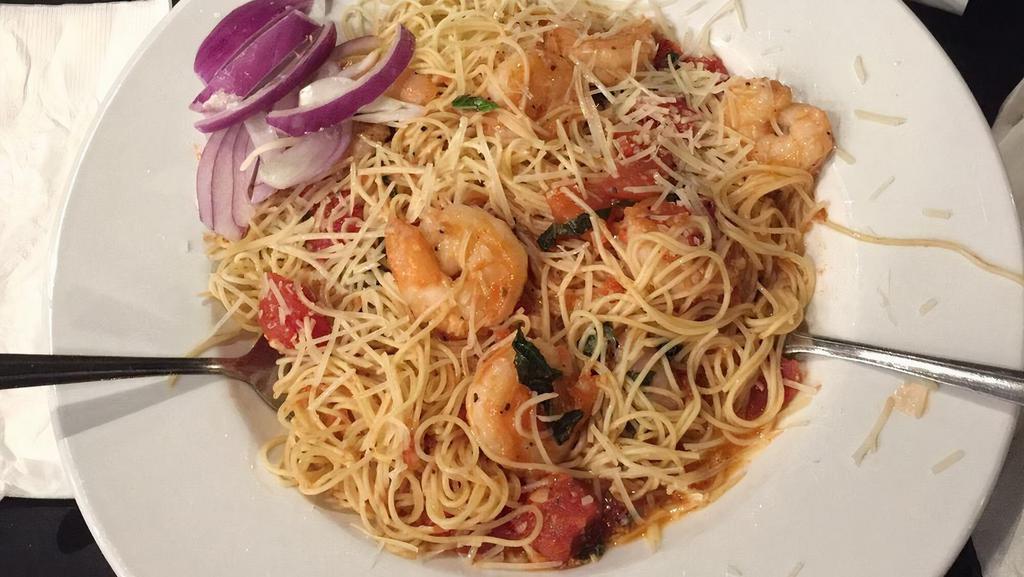 Shrimp With Angel Hair · Large shrimp sautéed with herbs, lemon and garlic combined with angel hair pasta in a tomato and fresh basil sauce.