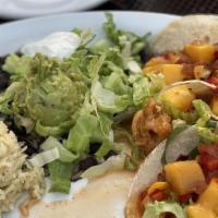 Shrimp Tacos · Three fresh corn tortillas filled with out fire cracker shrimp, crisp lettuce and mango sals...