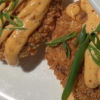 Crab Cakes · Crispy deviled crab cake with spicy chipotle aioli.