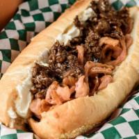 Far East Philly Cheesesteak · Steak seasoned with sweet ginger soy sauce, fried pickled red onions, and cream cheese on an...