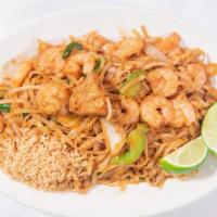 Pad Thai Shrimp · Spicy. Thai rice noodles stir fried with bean sprouts, egg, tofu, scallions, and ground pean...