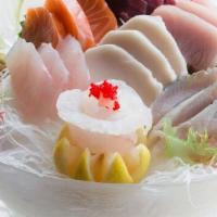 Sashimi Dinner · 15 pieces assorted raw fish and a bowl of white rice. Served with miso soup or salad.