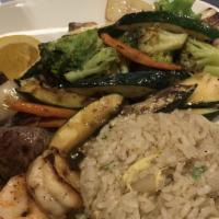 Steak And Shrimp Hibachi · Served with vegetables, fried rice, clear soup, and salad.