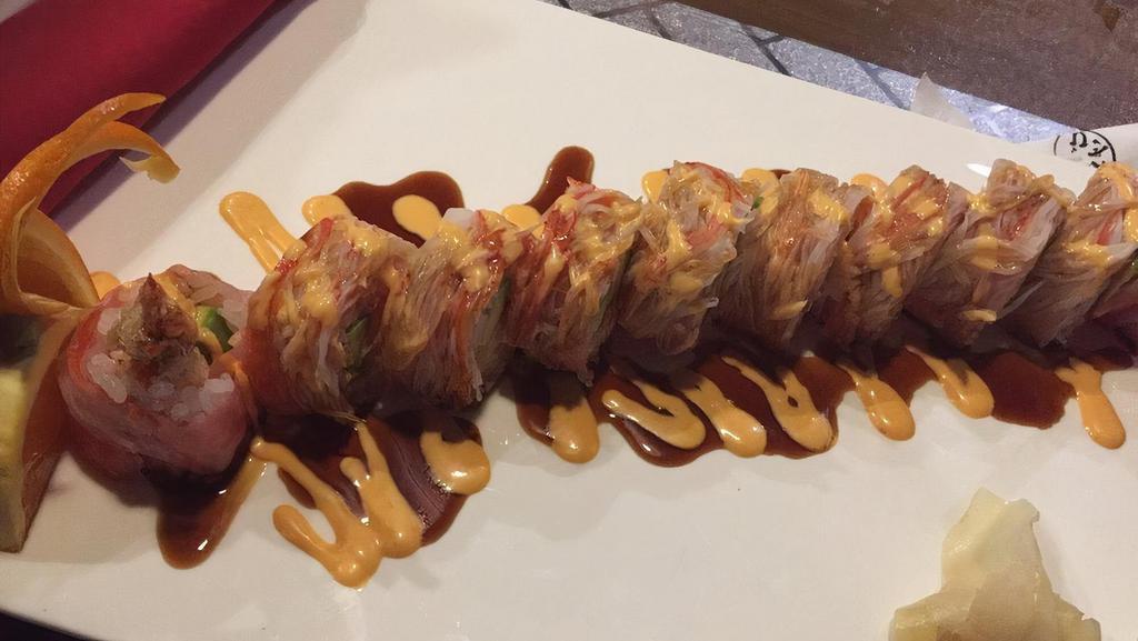 Angry Dragon Roll · Spicy. Shrimp tempura, avocado, spicy crunch tuna, and wrap with soy paper. Topped with crab stick, eel sauce, and spicy mayonnaise.
