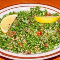 Tabouli · A parsley salad with mint, tomato, crushed wheat & onion with a light lemon & olive dressing.