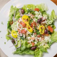 Greek Salad · Romaine lettuce, red onions, tomato, green peppers, cucumbers, olives & banana peppers with ...