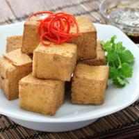 Garlic Tofu · Garlic tofu served with white rice.
