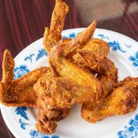 F6 Chicken Wings With Garlic Sauce (8) · Spicy.