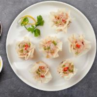 Shrimp Shumai · Shrimp wrapped in a wonton wrapper and steamed till perfection.