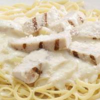 Chicken Alfredo Pasta · A bed of pasta and grilled chicken strips in alfredo sauce and finished with Pecorino Romano...