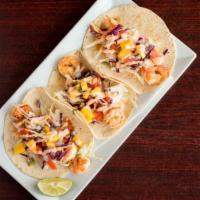 Camarón (3) · Seasoned shrimp topped with mango slaw served with pico de gallo and seafood sauce.

*Warnin...