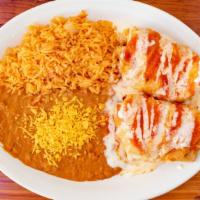 Chimichangas · 2 Fried tortilla pouches filled with your choice of meat. Smothered with queso and red sauce...