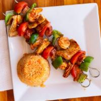 Brochettes · 2 Skewers of grilled onions, tomatoes, and peppers with your choice of meat. Served with ric...