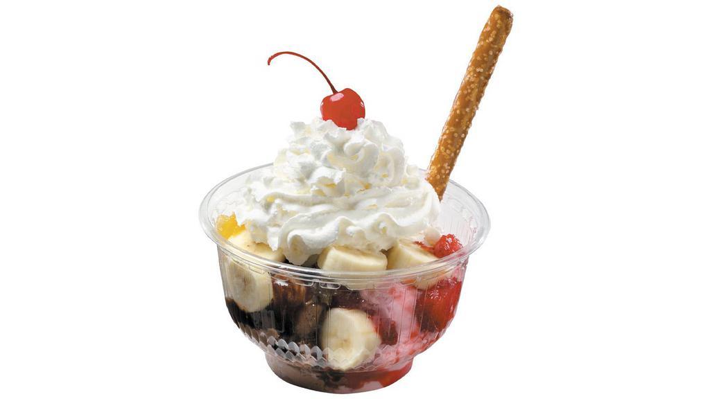 Banana Split Sundae · A true classic sundae with our freshly made ice cream flavors, toppings (chocolate syrup, strawberry, and pineapple), banana, whipped cream, and signature pretzel rod.