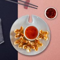 Wrangling Crab Rangoon · Golden fried wontons stuffed with cream cheese and crab meat. Served with sweet and sour sau...