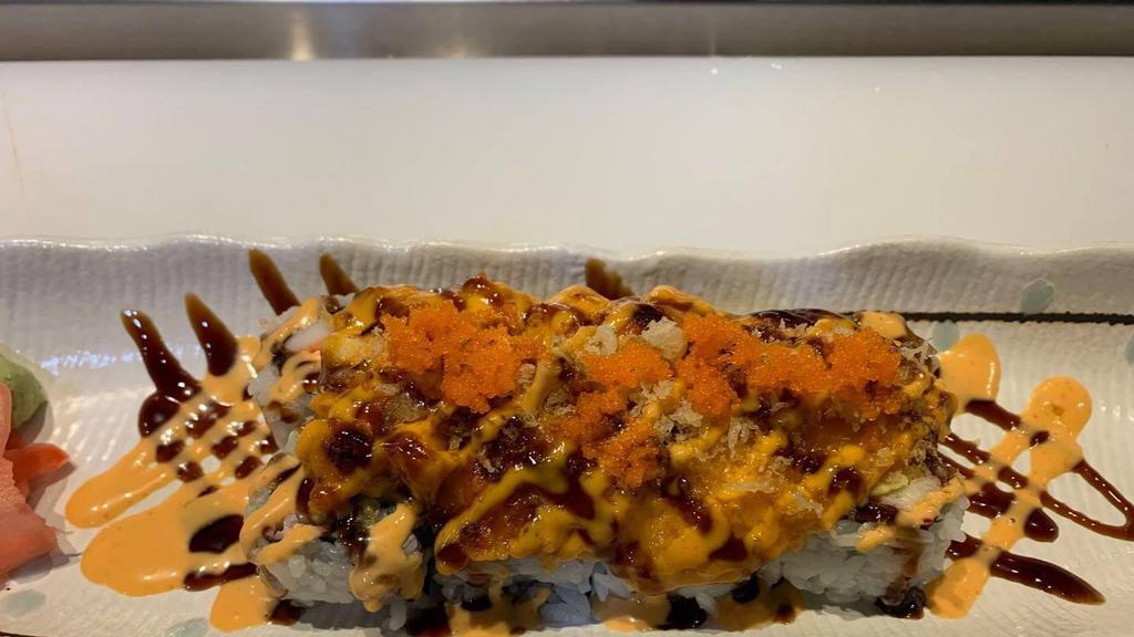 Volcanic Lava Roll · Crab, avocado and cream cheese inside.Topped with cheddar cheese, fish, masago,spicy mayo and eel sauce