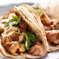 Free Range Chicken Tacos · Delicious street sized tacos with juicy free range chicken, cheese, lettuce, vinaigrette top...
