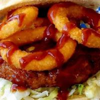 Bbq Shrimp Burger · Big shake's famous shrimp burger topped with crispy onion rings and tangy BBQ sauce and lett...
