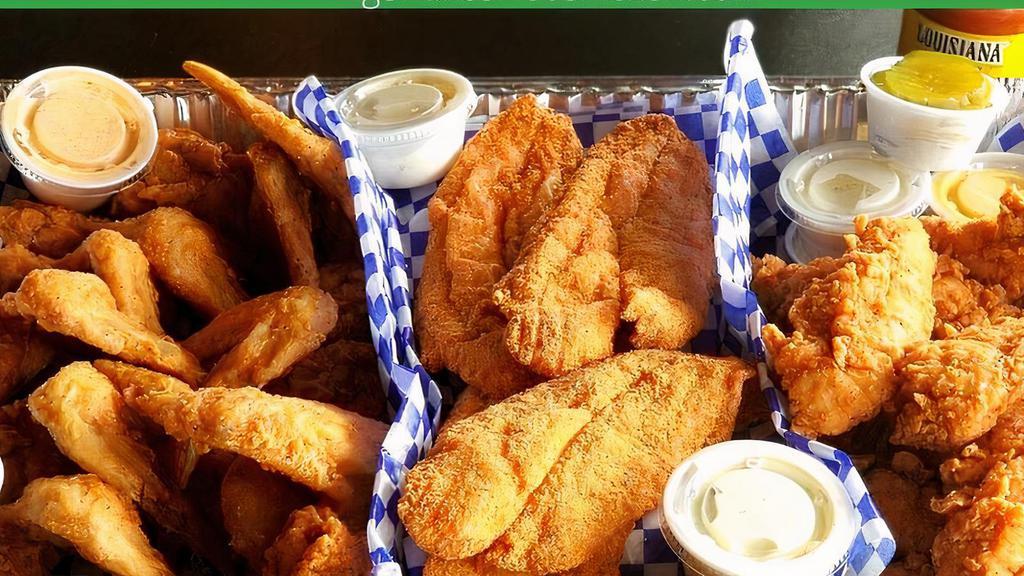 #2 (8) Catfish (4) Tenders, 2 Large Sides & Family Fries · Includes 8 catfish fillets, 4 jumbo chicken tenders, 2 pint size sides, family fries, white bread and pickles. Choose your heat level and up to 4 dipping sauces.